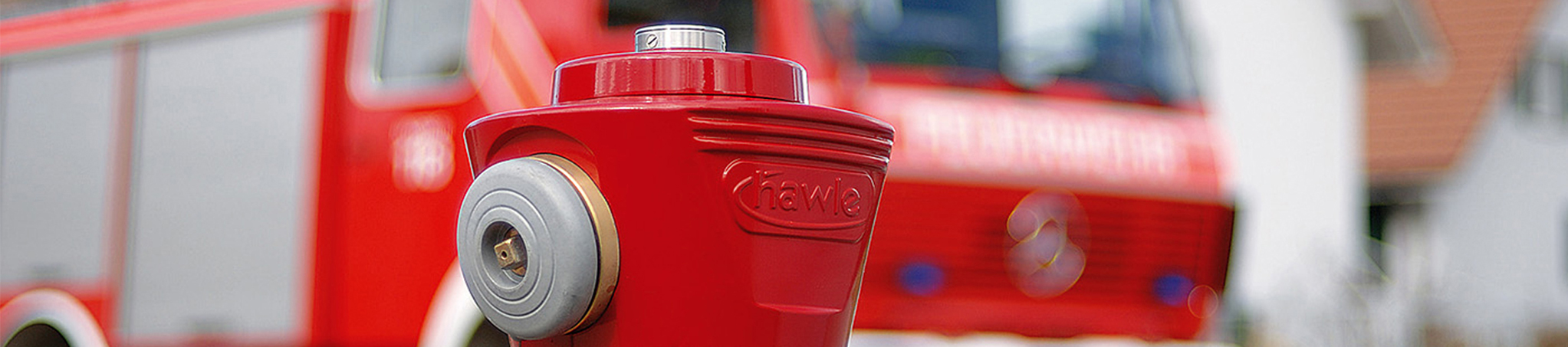 Schnittaufnahme eines roten Hydranten-Kopfes von Hawle als Themenbild für Header der Website